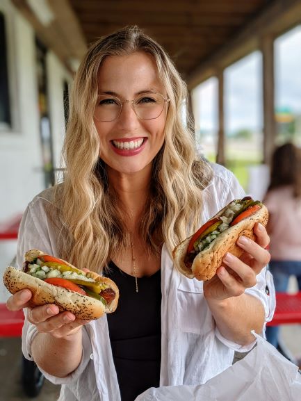 allyson holding hot dogs from hot dog heaven