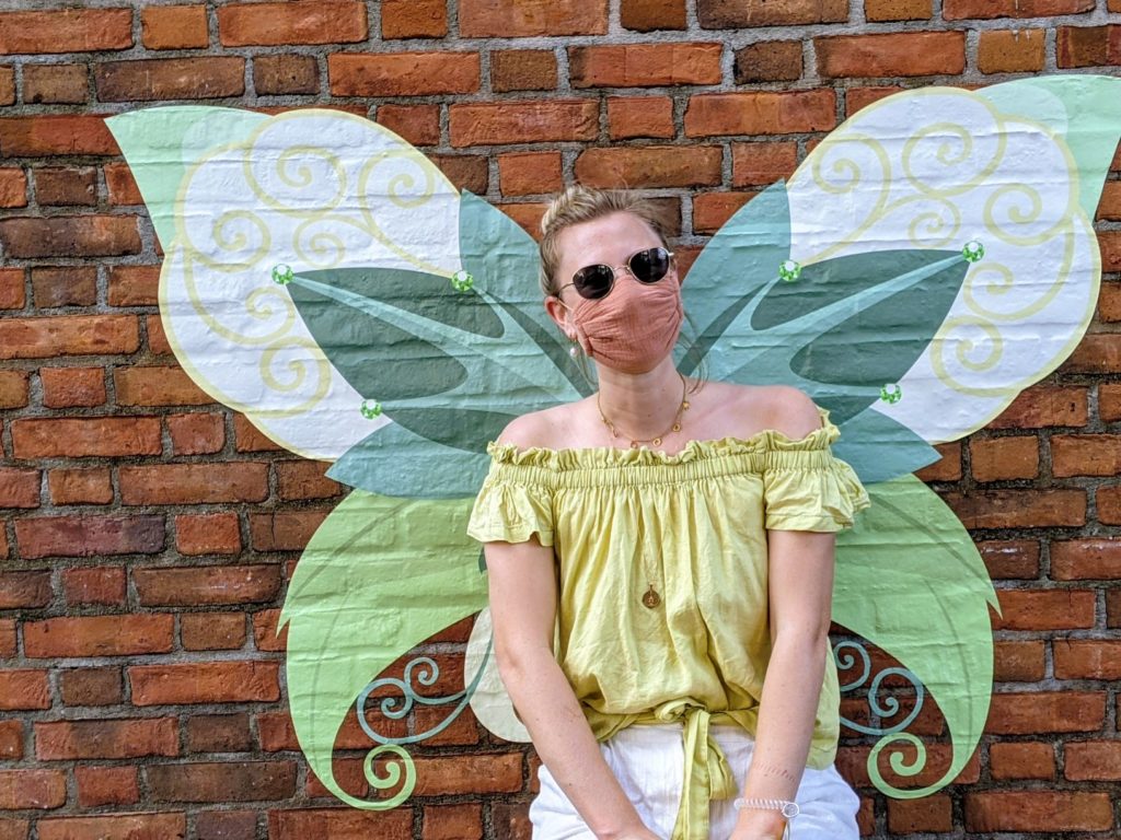 allysoneatz at festival of the arts at a tinkerbelle wall