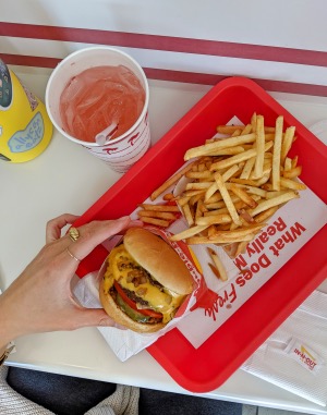 in-n-out burger with fries and a pink lemonade