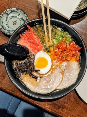 bowl of tonkotsu ramen with chasu ginger veggie and an egg